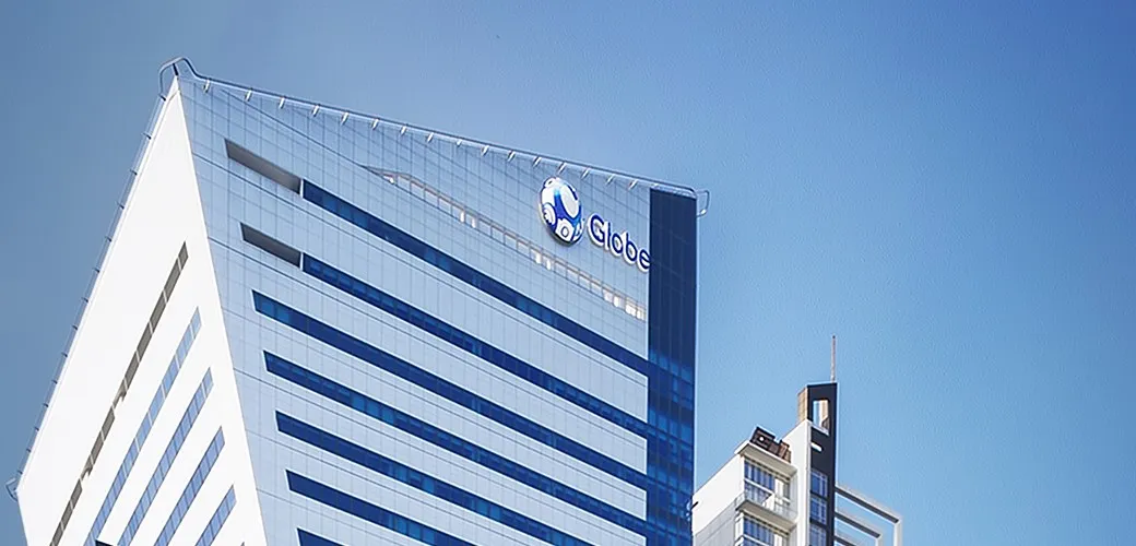 A Globe Telecom office tower against a blue sky